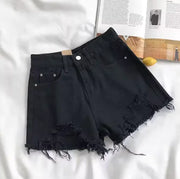 Short en jean taille haute déchiré.