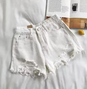 Short en jean taille haute déchiré.