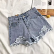 Short en jean taille haute déchiré.