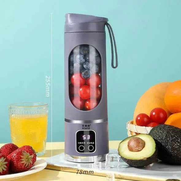 Mixeur à smoothie portable Beautysky avec fruits frais et verre à côté sur une table lumineuse