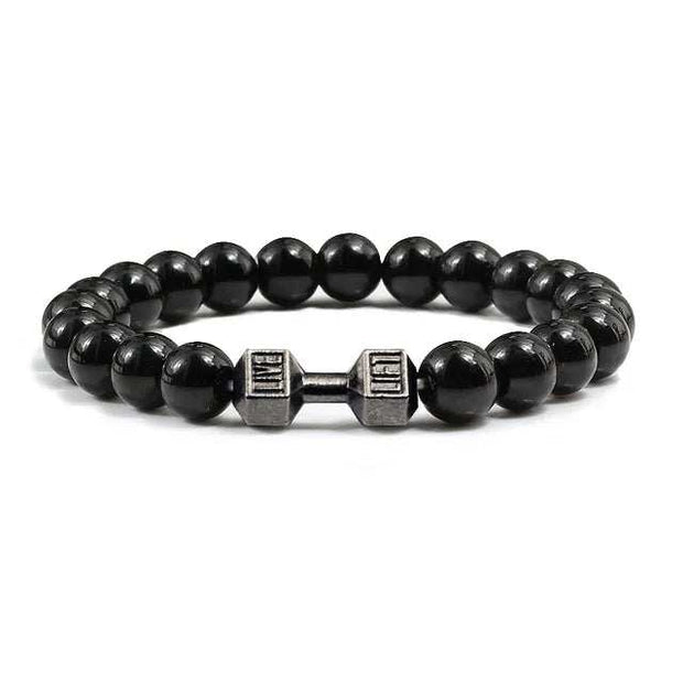 Bracelet pierre volcanique avec perles noires et un détail en métal en forme d'haltère