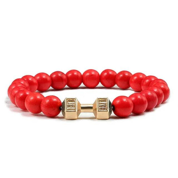 Bracelet pierre volcanique rouge avec détails en métal doré pour un look tendance et sportif