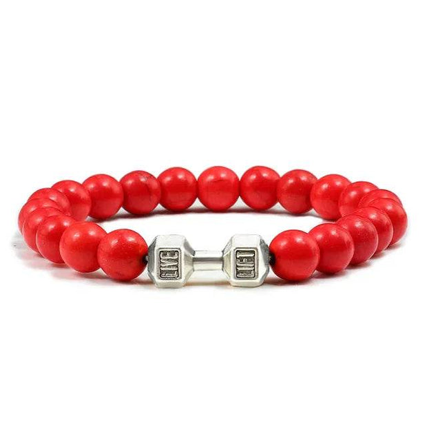 Bracelet pierre volcanique rouge avec embellissement en forme d'haltère pour un style sport chic