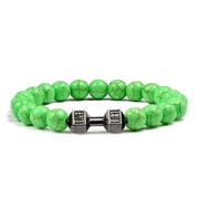 Bracelet en pierre volcanique avec perles vertes et poids en métal décoratif au centre