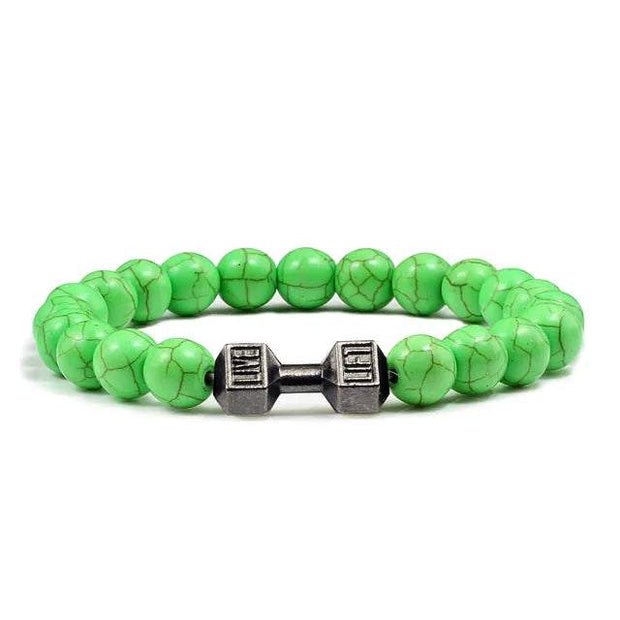 Bracelet en pierre volcanique avec perles vertes et poids en métal décoratif au centre