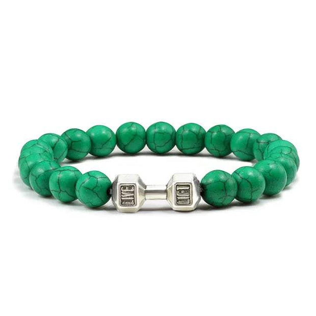 Bracelet en pierre volcanique avec perles vertes et accents en métal pour un style unique