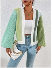 Cardigan ample femme en tricot vert et blanc avec manches bouffantes et design moderne