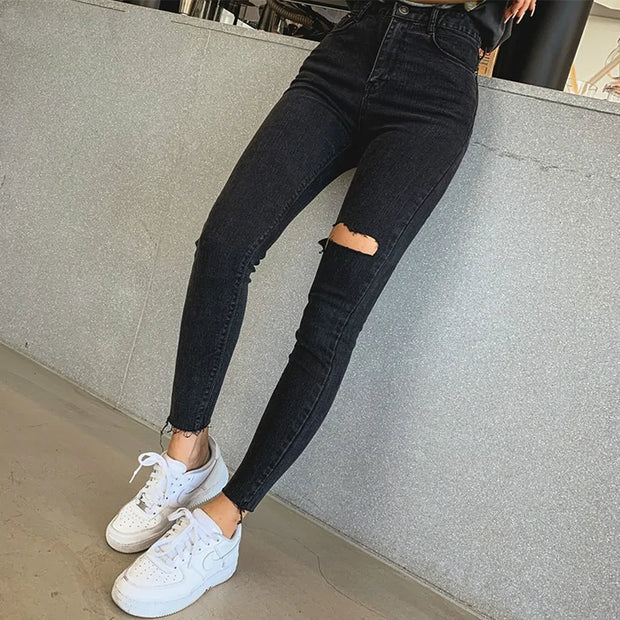 Pantalon skinny taille haute en denim déchiré à franges - Jean noir pour femme.