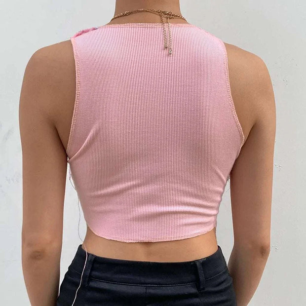 Débardeur femme chic rose avec un design côtelé et une coupe courte pour un style tendance