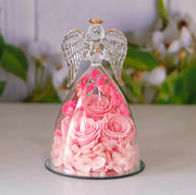Décoration bouteille en verre fleur séchée avec roses roses et figurine d'ange pour un style élégant