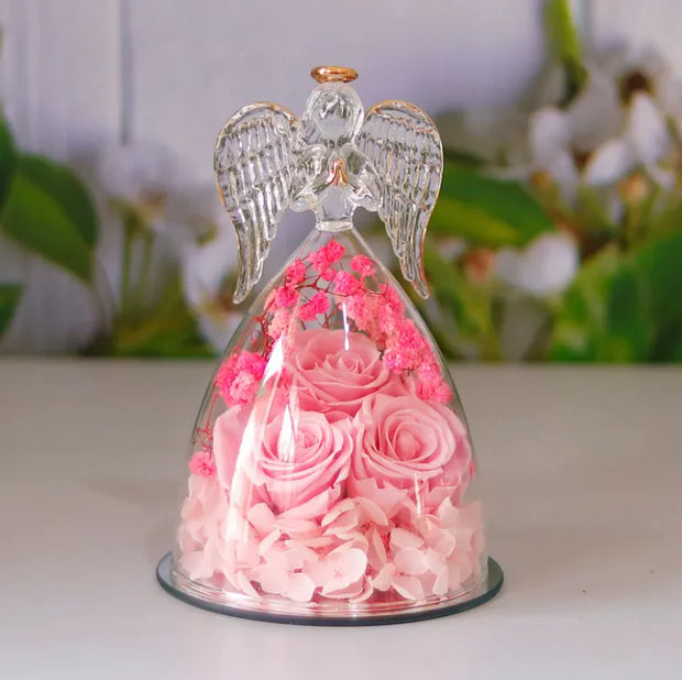 Décoration bouteille en verre fleur séchée avec roses roses et figurine d'ange pour un style élégant
