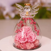 Décoration bouteille en verre fleur séchée avec des roses roses et un ange en verre
