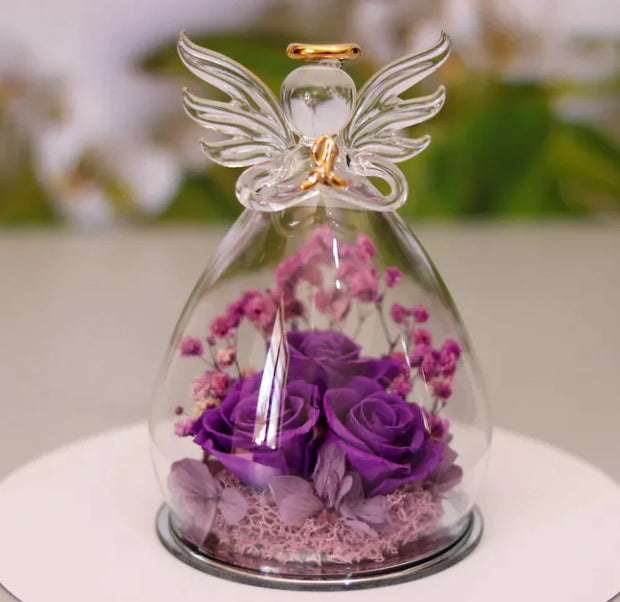Décoration bouteille en verre fleur séchée avec des roses violettes et un ange en cristal