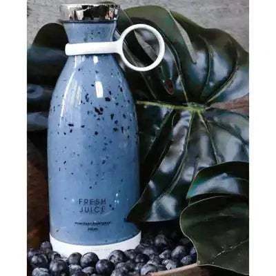Beautysky portable blender for smoothies in a stylish blue design surrounded by fresh blueberries