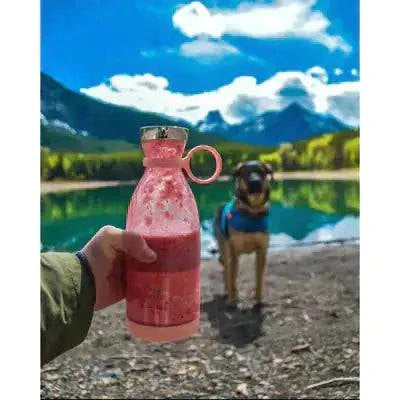 Beautysky portable blender for smoothies with pink smoothie by a scenic lake and a dog in the background