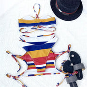 Striped thong bikini from Beautysky on display with colorful design and matching accessories.