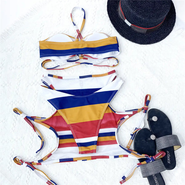 Striped thong bikini from Beautysky on display with colorful design and matching accessories.