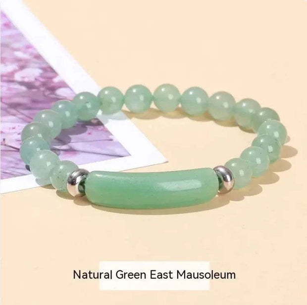 Natural stone bracelet for women featuring green beads and a jade centerpiece for a stylish look
