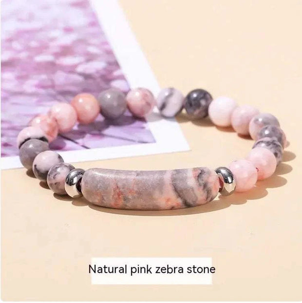Natural pink zebra stone bracelet for women with a unique bead design and silver accents