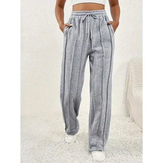 Pantalon ample femme en gris avec poches latérales et taille élastique pour un look décontracté