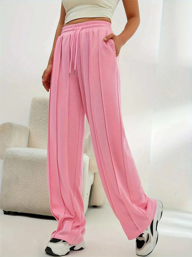 Pantalon ample femme en rose avec taille élastique et poches pour un look décontracté
