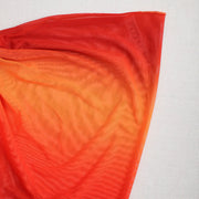 Paréo de plage femme Beautysky en dégradé orange sur fond clair.
