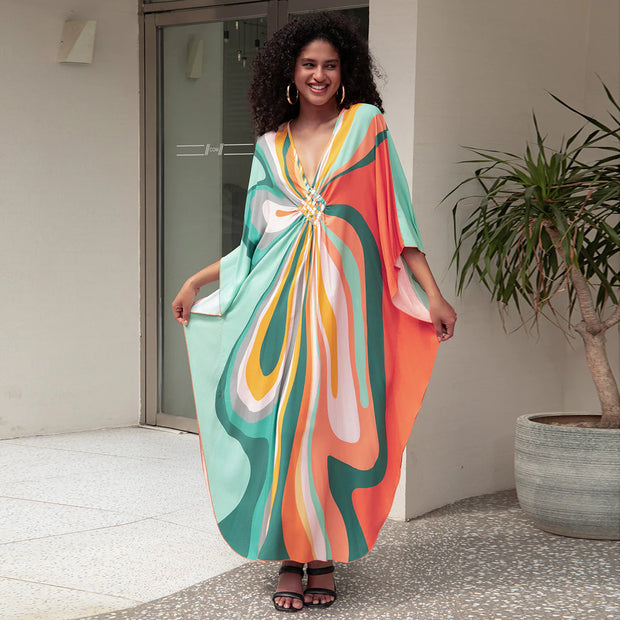 Robe bohème été femmes en motifs colorés avec décolleté et manches larges, idéale pour les journées ensoleillées