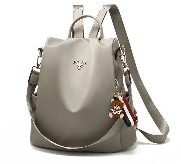 Waterproof Oxford backpack for women by Beautysky with adjustable straps and teddy bear charm.
