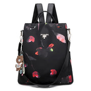 Waterproof Oxford backpack for women with floral design and adjustable straps.
