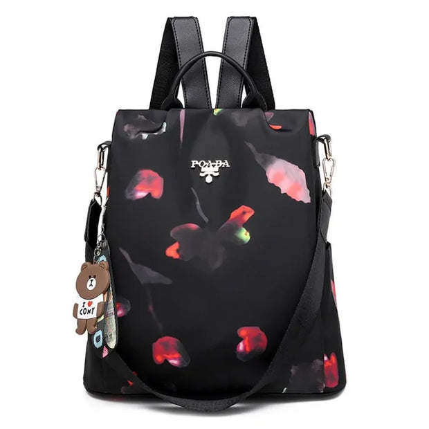 Waterproof Oxford backpack for women with floral design and adjustable straps.