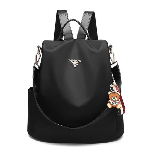Waterproof Oxford backpack for women with adjustable straps and multiple compartments.
