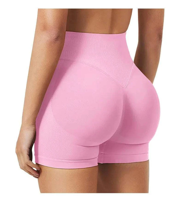 Short de yoga taille haute en rose avec un design sculptant pour un confort optimal pendant l'entraînement