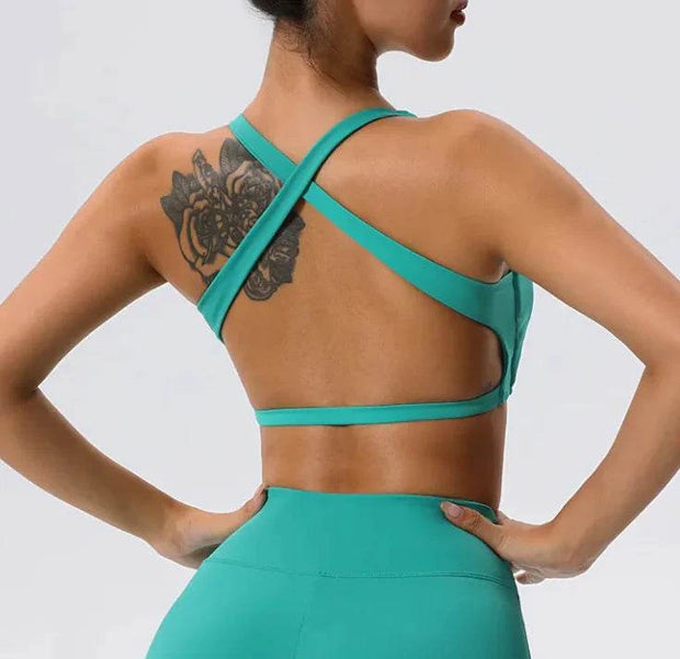Soutien-gorge sport femme en turquoise avec dos croisé pour un confort optimal pendant l'entraînement